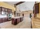 Well-appointed kitchen with a large island, custom cabinets, stainless steel appliances, and granite counters at 1435 E Rancho Dr, Phoenix, AZ 85014
