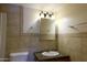 Charming bathroom vanity with a granite countertop and unique backsplash at 151 E Broadway Rd # 206, Tempe, AZ 85282