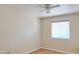 Carpeted bedroom featuring a ceiling fan and a window for natural light at 151 E Broadway Rd # 206, Tempe, AZ 85282