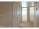Bright hallway with neutral walls and carpet, leading to various rooms in the home at 151 E Broadway Rd # 206, Tempe, AZ 85282