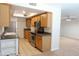 Kitchen with stainless steel appliances, oak cabinets, granite countertops and tile flooring at 151 E Broadway Rd # 206, Tempe, AZ 85282