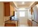Kitchen with stainless steel appliances, oak cabinets, granite countertops and tile flooring at 151 E Broadway Rd # 206, Tempe, AZ 85282