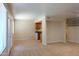 Spacious living room with carpet flooring, a ceiling fan, and a kitchen view at 151 E Broadway Rd # 206, Tempe, AZ 85282