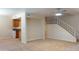 Open floor plan with living room open to kitchen and stairs leading to the second story at 151 E Broadway Rd # 206, Tempe, AZ 85282