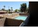 View of the community pool from the home's second story balcony at 151 E Broadway Rd # 206, Tempe, AZ 85282