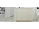 Modern bathroom features a white vanity, stylish mirror, and a convenient toilet at 15597 W Williams St, Goodyear, AZ 85338