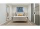 Inviting bedroom displaying a comfortable bed with lamps on side tables and patterned wallpaper at 15597 W Williams St, Goodyear, AZ 85338