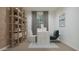 Inviting home office with a desk, shelves, and a comfortable chair, perfect for productivity at 15597 W Williams St, Goodyear, AZ 85338