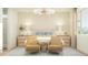 Calm and comfortable bedroom featuring neutral colors, two bedside tables with lamps, and a full-sized bed at 15797 W Kendall St, Goodyear, AZ 85338