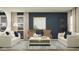 Cozy living room featuring hardwood floors, neutral-toned furniture, and plenty of space for relaxation at 15797 W Kendall St, Goodyear, AZ 85338