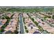 Stunning aerial view of a well-maintained community with solar panels and a beautiful golf course nearby at 1804 E Sattoo Way, Queen Creek, AZ 85140