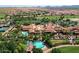 Expansive aerial perspective of the community showcasing the clubhouse, pools, and well-manicured landscaping at 1804 E Sattoo Way, Queen Creek, AZ 85140