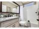 Bathroom featuring granite countertops, mosaic backsplash, tile floors, and updated finishes at 1804 E Sattoo Way, Queen Creek, AZ 85140