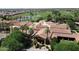 Aerial view of the clubhouse and pool surrounded by palm trees, offering a relaxing and luxurious atmosphere at 1804 E Sattoo Way, Queen Creek, AZ 85140