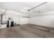 Spacious garage with water heater and shelving, providing ample storage space at 1804 E Sattoo Way, Queen Creek, AZ 85140