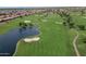 Aerial view of the community's golf course featuring a water hazard and well-maintained fairways at 1804 E Sattoo Way, Queen Creek, AZ 85140