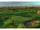 Scenic golf course with pristine greens, sand bunkers, and distant mountain views under a clear sky at 1804 E Sattoo Way, Queen Creek, AZ 85140