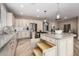 Bright kitchen with large island, granite countertops, stainless steel appliances, and custom cabinets at 1804 E Sattoo Way, Queen Creek, AZ 85140