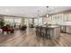 Bright, open-concept living space featuring a modern kitchen island and comfortable seating area at 1804 E Sattoo Way, Queen Creek, AZ 85140