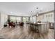 Bright, open-concept living space featuring a modern kitchen island and comfortable seating area at 1804 E Sattoo Way, Queen Creek, AZ 85140