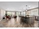 Bright, open-concept living space featuring a modern kitchen island and comfortable seating area at 1804 E Sattoo Way, Queen Creek, AZ 85140