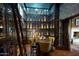 Elegant wine cellar showcases custom storage and seating, perfect for wine enthusiasts and collectors at 1804 E Sattoo Way, Queen Creek, AZ 85140