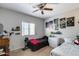 Bright bedroom with ceiling fan, window, and neutral walls at 20142 N 260Th Dr, Buckeye, AZ 85396