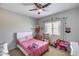 Charming pink bedroom with bright light and lots of decor at 20142 N 260Th Dr, Buckeye, AZ 85396