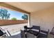 Relaxing covered patio with stylish outdoor furniture perfect for entertaining and enjoying backyard views at 20142 N 260Th Dr, Buckeye, AZ 85396