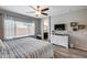 Brightly lit main bedroom with ensuite bathroom and hard floors at 20142 N 260Th Dr, Buckeye, AZ 85396