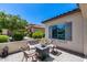 Cozy outdoor patio with seating and view of a landscaped yard, creating a relaxing outdoor living space at 20142 N 260Th Dr, Buckeye, AZ 85396