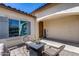 Welcoming front porch with comfortable seating, enhancing the home's curb appeal and providing a relaxing space at 20142 N 260Th Dr, Buckeye, AZ 85396