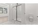 Bathroom featuring large glass shower with subway tile, seat and tiled floors at 20308 W Roma Ave, Buckeye, AZ 85396