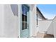 Stylish turquoise front door in a bright white stucco home at 20308 W Roma Ave, Buckeye, AZ 85396