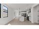 Stylish kitchen featuring a center island, stainless steel appliances, and modern lighting at 20308 W Roma Ave, Buckeye, AZ 85396