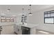 Kitchen island with stainless steel dishwasher and farmhouse sink at 20308 W Roma Ave, Buckeye, AZ 85396