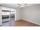 Well-lit bedroom with ceramic tile flooring, slider to patio and a ceiling fan at 2040 S Longmore St # 7, Mesa, AZ 85202