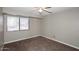 Neutral bedroom with carpet and a ceiling fan plus natural light from the window at 2040 S Longmore St # 7, Mesa, AZ 85202