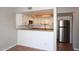 Bright kitchen features white cabinets, a tile floor, and stainless steel appliances, perfect for cooking and entertaining at 2040 S Longmore St # 7, Mesa, AZ 85202