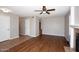Spacious living room with hardwood floors, neutral paint, recessed lights, and fireplace at 2040 S Longmore St # 7, Mesa, AZ 85202
