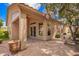 Inviting covered back patio with brick pavers, ceiling fan and easy access to the beautifully landscaped backyard at 20740 N 62Nd Ave, Glendale, AZ 85308
