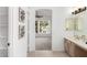 Bathroom with double sinks, carpeted room view, and stylish decor at 20740 N 62Nd Ave, Glendale, AZ 85308