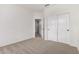 Bedroom with carpet and double-door closet provides ample storage space at 20740 N 62Nd Ave, Glendale, AZ 85308