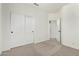 Bedroom with carpet, double door closet, and doorway at 20740 N 62Nd Ave, Glendale, AZ 85308
