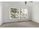 Spacious bedroom with carpeted floor and a beautiful view of the water and trees at 20740 N 62Nd Ave, Glendale, AZ 85308
