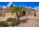 Charming single-Gathering home with desert landscaping, stone accents, and an arched entryway at 20740 N 62Nd Ave, Glendale, AZ 85308