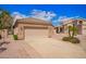 Detached two-car garage featuring an extended driveway and desert landscaping at 20740 N 62Nd Ave, Glendale, AZ 85308