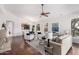 Open-concept living area with hardwood floors and bright natural light, showing kitchen and fireplace at 20740 N 62Nd Ave, Glendale, AZ 85308