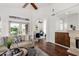 Comfortable living area with hardwood floors, fireplace, and views of the backyard waterway at 20740 N 62Nd Ave, Glendale, AZ 85308