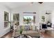 Cozy living room with large windows overlooking water, comfortable seating, and stylish decor at 20740 N 62Nd Ave, Glendale, AZ 85308